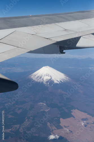 Top of Mountain Fuji with snow in winter season   taken from on airplane after takeoff from Tokyo Haneda international airport