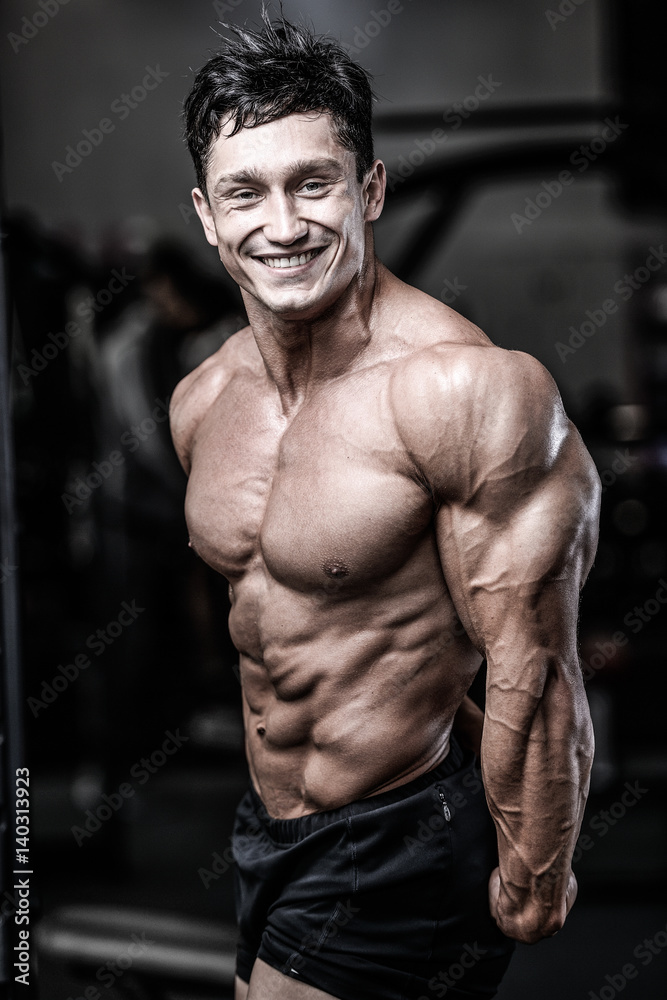 Brutal caucasian handsome fitness men on diet training triceps gym Brutal caucasian handsome fitness men on diet training triceps gym