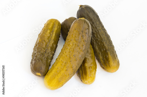 Pickled cucumbers on white isolated background