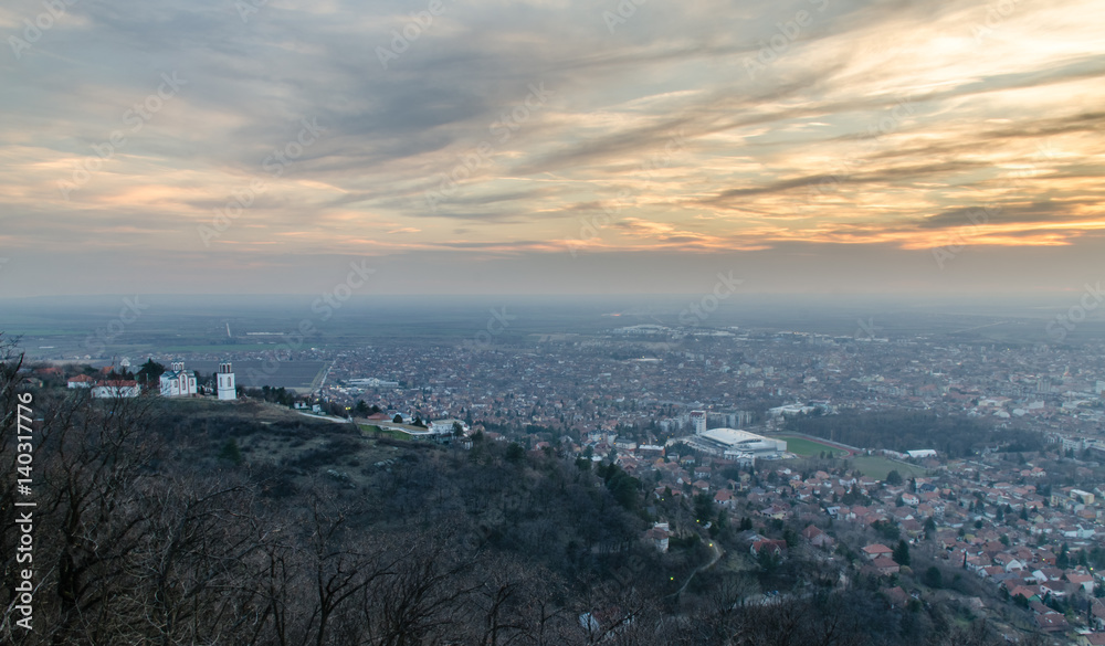 City in the valley at sunset