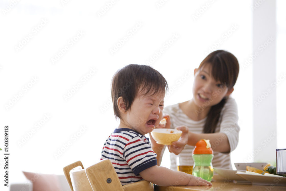 Baby Boy Crying Whilst Mother Offering Food Baby Boy Crying Whilst Mother Offering Food