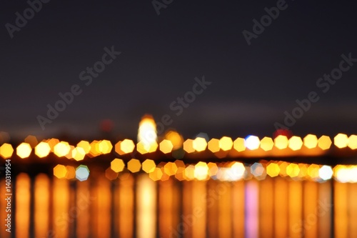 Abstract bokeh of bright city lights background. Can be used as a trendy background for wallpapers, posters, cards, invitations, websites. 