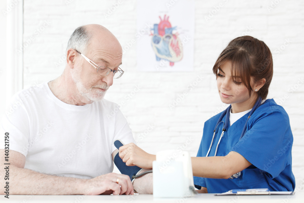 Doctor measuring blood pressure Doctor measuring blood pressure