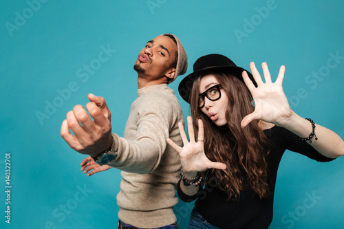 Obraz na plátne Funny young modern couple dancing and having fun together