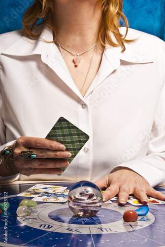 Canvas-taulu fortune teller astrologer with esoteric tools cards, zodiac signs, horoscope and