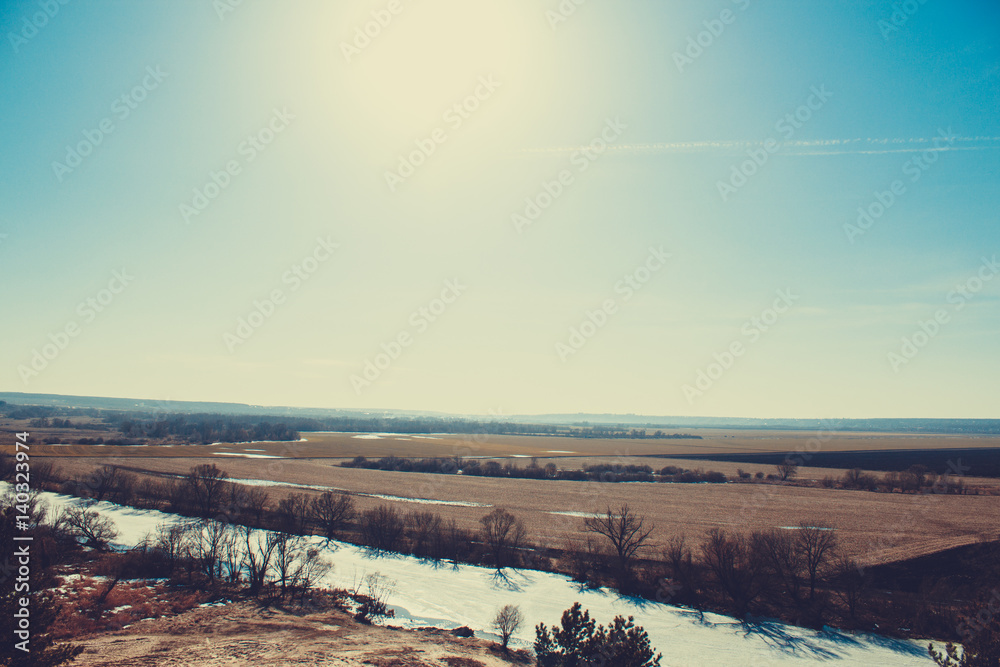 Beautiful landscape, sunny spring day view of the field, clear sky