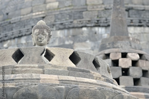 Borobudur Buddist Temple in island Java Indonesia. Detail of Buddhist carved relief in Borobudur temple in Yogyakarta, Java, Indonesia.. photo