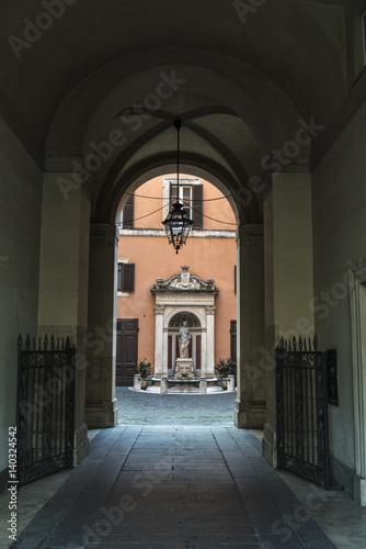 Entrance of an old classic decor building in Rome, Italy