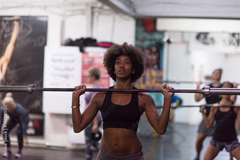 black woman lifting empty bar black woman lifting empty bar