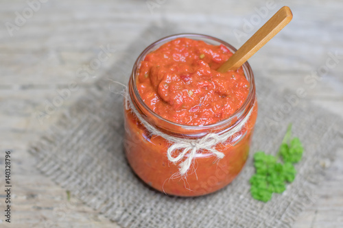 Ajvar - traditional macedonian serbian dish made from red bell peppers, eggplant and garlic, lutenitza, popular in Balkans. Homemade tomato sauce for pasta.