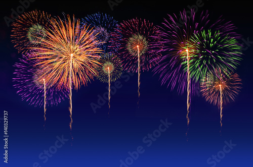 Colorful fireworks celebration and the twilight sky background.