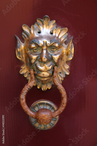 Traditional knockers on the wooden door in Mdina, Malta. traditional Maltese door handle