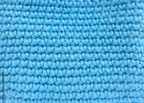Crochet pattern, a close-up of a simple blue crochet pattern for background