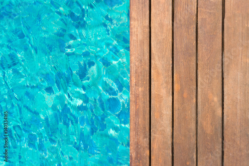 wooden platform at swimming pool with text space