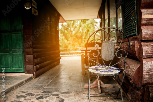 Resting corner with wooden chair and sunlight