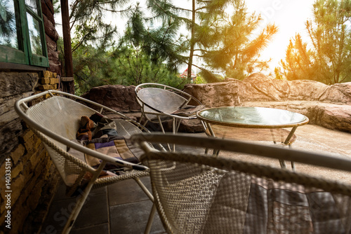 Resting corner with wooden chair and sunlight