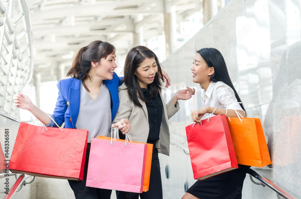 Group of happy shopping asia women with shopping bags. Happiness, consumerism, sale concept. Group of happy shopping asia women with shopping bags. Happiness, consumerism, sale concept.