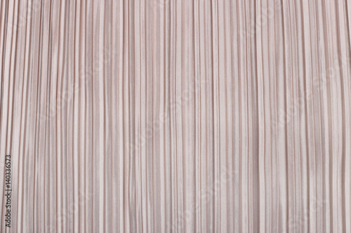 Soft pink pleated fabric. Plisse fabric texture background.