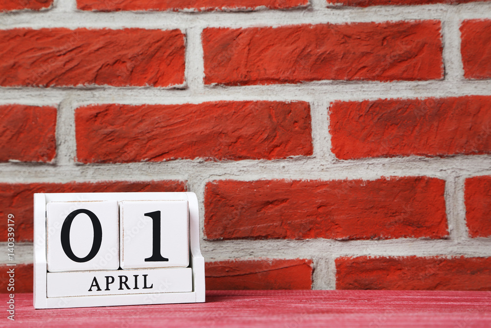 Cube calendar on a brick wall background Cube calendar on a brick wall background
