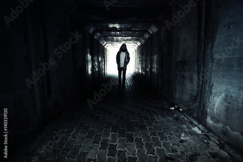 Obraz na płótnie Homeless person walking on the street ,Stranger person in tunnel