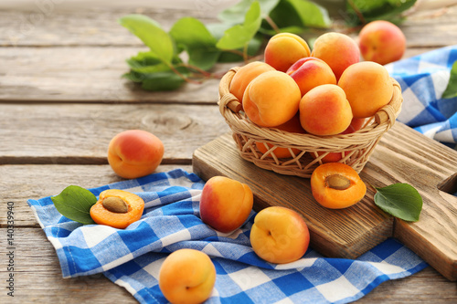 Ripe apricots fruit on grey wooden table
