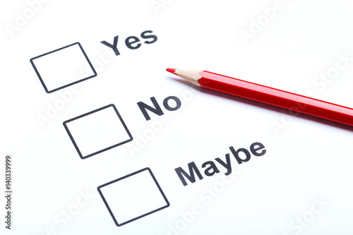 Check boxes yes, no and maybe on white paper photo