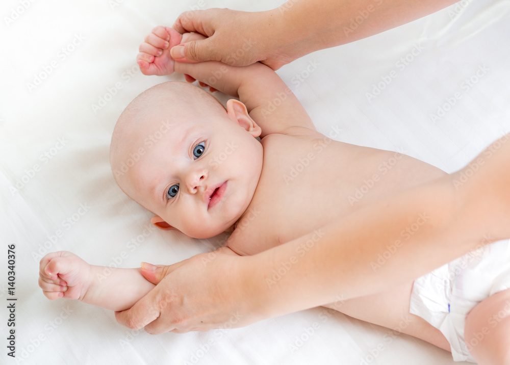 Cute smiling baby gymnastic practice Cute smiling baby gymnastic practice