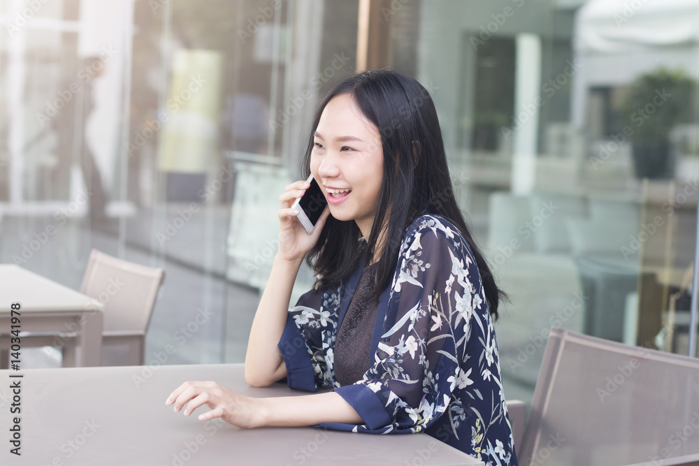 Fototapeta premium Asian woman is happiness when negotiating successful in business