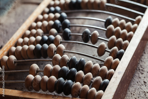Vintage abacus lay on stone table