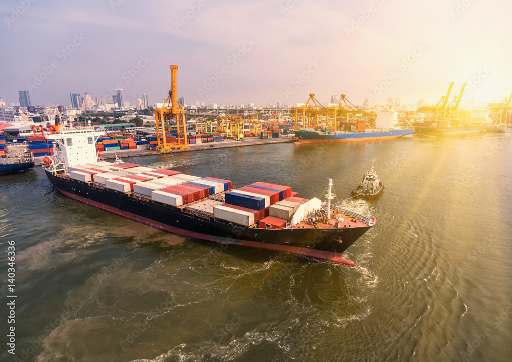 container ship in import export and business logistic.By crane ,Trade Port , Shipping.cargo to harbor.Aerial view.Water transport.International.Shell Marine.Top view. container ship in import export and business logistic.By crane ,Trade Port , Shipping.cargo to harbor.Aerial view.Water transport.International.Shell Marine.Top view.