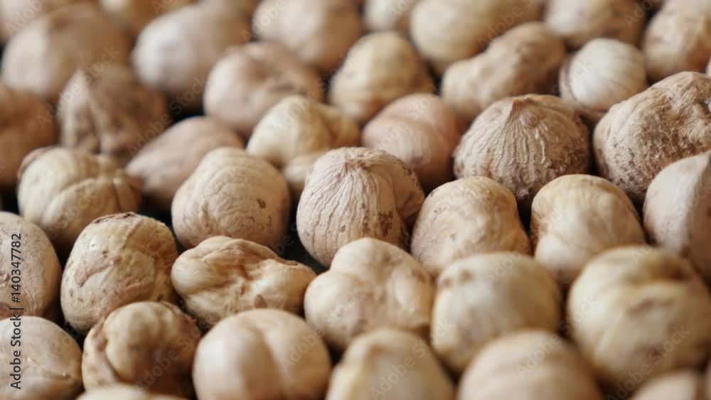 Panning on Corylus avellana cob fruit on table 4K 2160p 30fps UltraHD footage - Slow pan food background of raw common hazelnuts close-up 3840X2160 UHD video Panning on Corylus avellana cob fruit on table 4K 2160p 30fps UltraHD footage - Slow pan food background of raw common hazelnuts close-up 3840X2160 UHD video