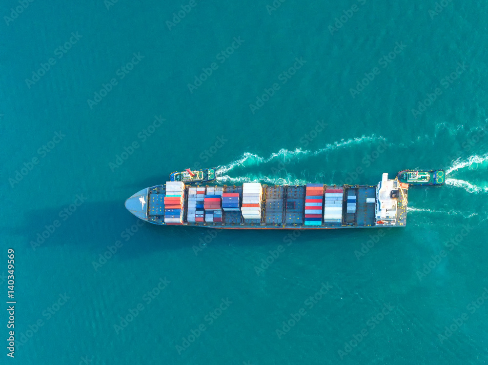 Fototapeta premium container ship in import export and business logistic.By crane ,Trade Port , Shipping.cargo to harbor.Aerial view.Water transport.International.Shell Marine.Top view.