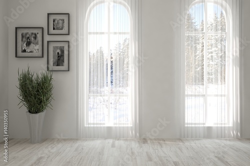 White empty room with winter landscape in window. Scandinavian interior design. 3D illustration © AntonSh