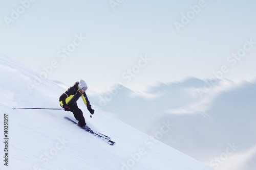 Skier in high mountains