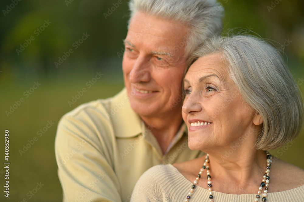 Happy elderly couple embracing