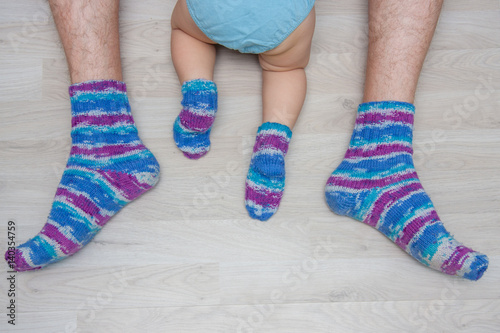 Father and son in the same knitted socks