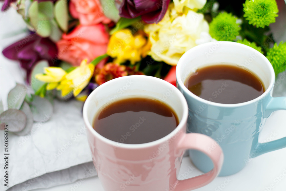 Morning Cup of coffee and a beautiful roses flowers on light background, top view. Cozy Breakfast. Flat lay style. Morning Cup of coffee and a beautiful roses flowers on light background, top view. Cozy Breakfast. Flat lay style.