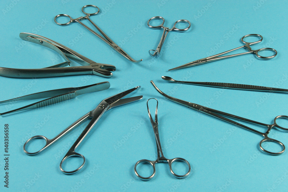 Surgical Instruments on blue background. Surgical Instruments on blue background.