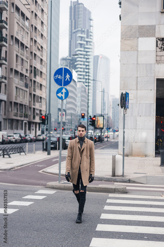 Beautiful young man posing in an urban context Beautiful young man posing in an urban context