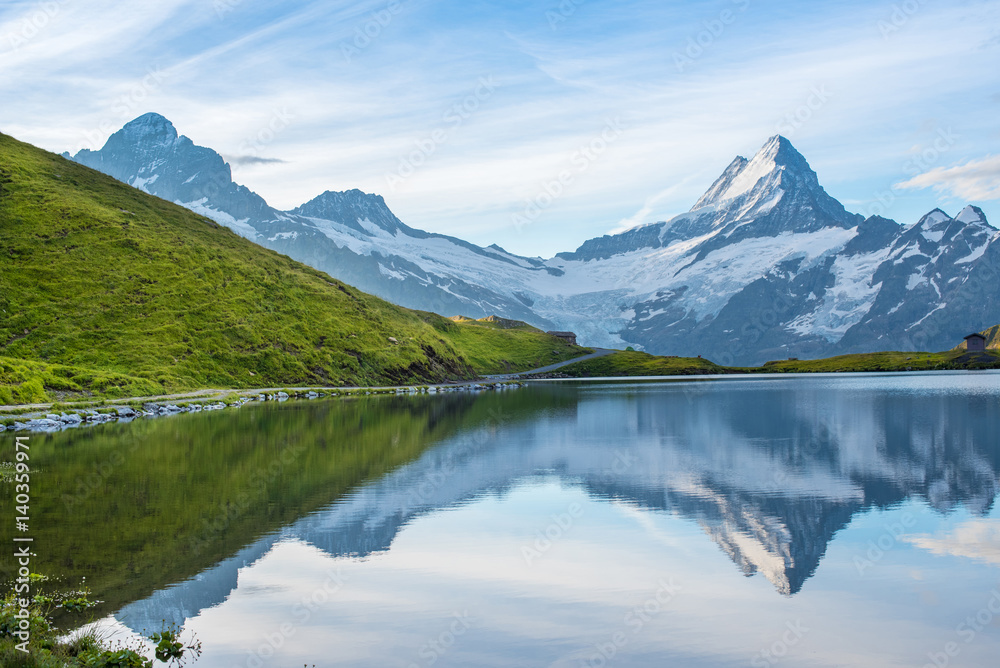 A magical landscape with a lake in the mountains in the Swiss Alps, Europe. Wetterhorn, Schreckhorn, Finsteraarhorn et Bachsee. ( relaxation, harmony, anti-stress - concept).