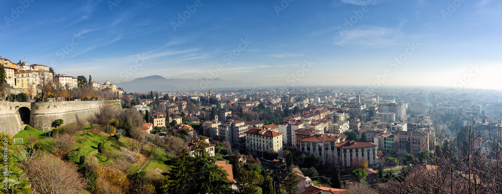 Aerial panoramic view of foggy Bergamo town in northern Italy
