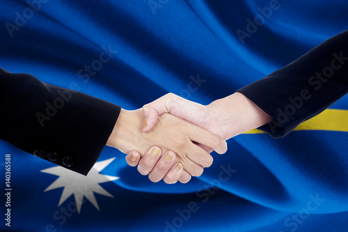 Collaboration handshake with flag of Nauru