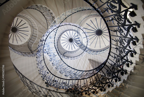Fotografie, Obraz Multiple exposure image of spiral stairs, London. Greenwich house