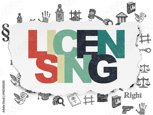 Law concept  Licensing on Torn Paper background
