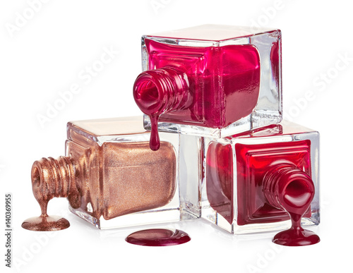 Nail polish dripping from stacked bottles