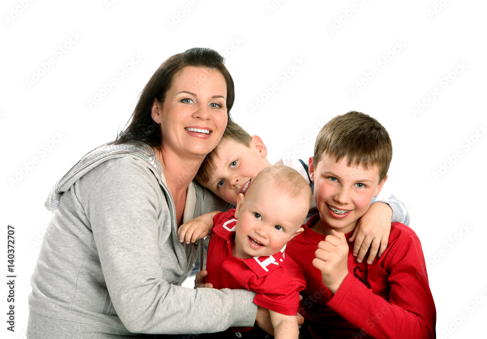 Two Sons Sit next to their mother on the White Background Two Sons Sit next to their mother on the White Background