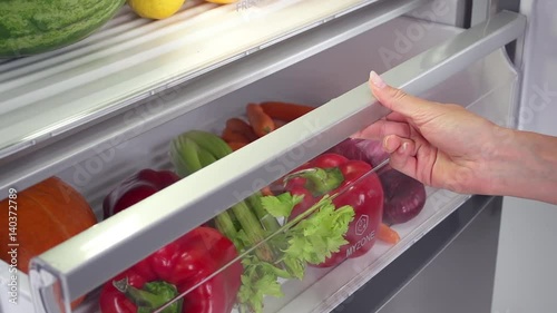 Vegetables in fridge in slow motion