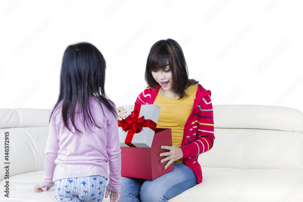 Surprised mother opens a presents box