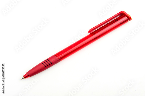 red ballpoint pen on a white background