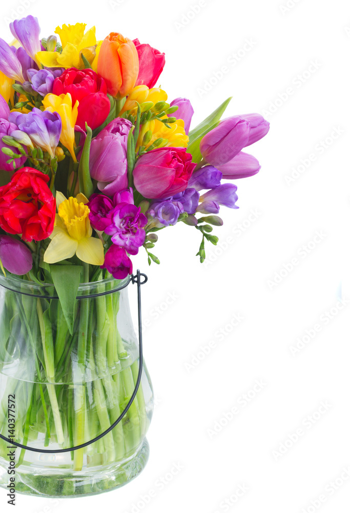 bouquet of bright spring flowers in vase isolated on white background